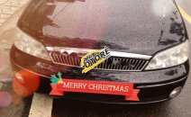 Bán ô tô Ford Laser Ghia 1.8 sản xuất 2002, màu đen chính chủ, giá 185tr Bán ô tô Ford Laser Ghia 1.8 sản xuất 2002, màu đen chính chủ, giá 185tr