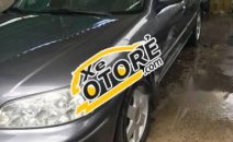 Cần bán lại xe Ford Laser Ghia đời 2002, màu xám, giá tốt Cần bán lại xe Ford Laser Ghia đời 2002, màu xám, giá tốt
