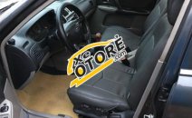 Cần bán xe Ford Laser 1.8 MT đời 2002, màu đen Cần bán xe Ford Laser 1.8 MT đời 2002, màu đen