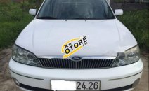 Bán xe Ford Laser Ghia 1.8 năm 2002, màu trắng, 168 triệu Bán xe Ford Laser Ghia 1.8 năm 2002, màu trắng, 168 triệu